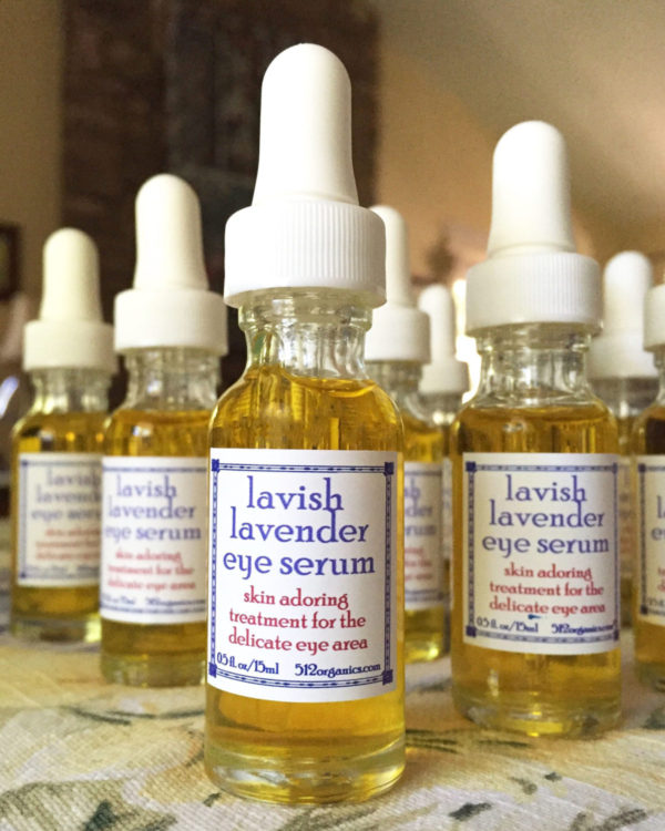 512organics several bottles of Lavish Lavender eye serum on tablecloth