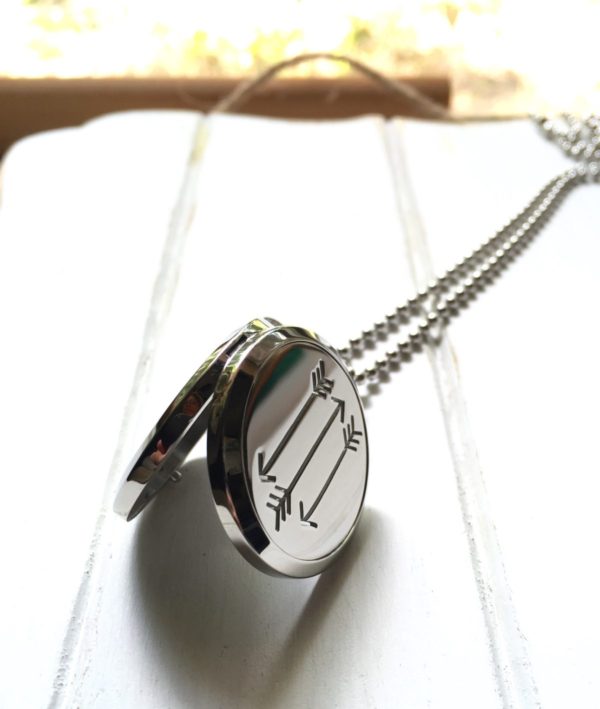 512organics silver arrow oil diffusing necklace on white wood