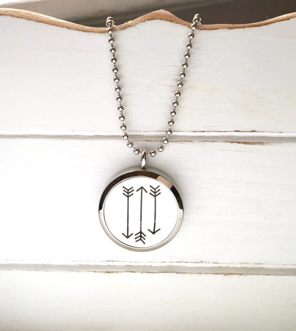 512organics silver arrow oil diffusing necklace on white wood