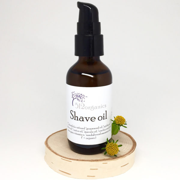 512organics bottle of shave oil with flowers